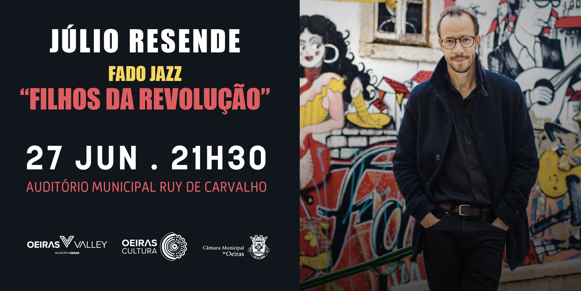 Imagem do Julio Resende com um grafiti no fundo.  